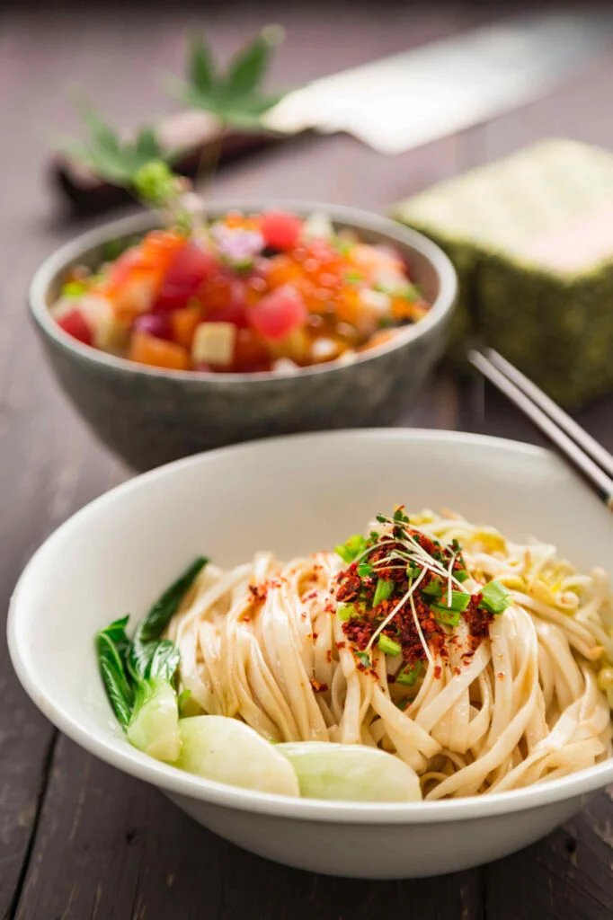 A bowl of Japanese dry Ramen noodles seasoned with herbs.